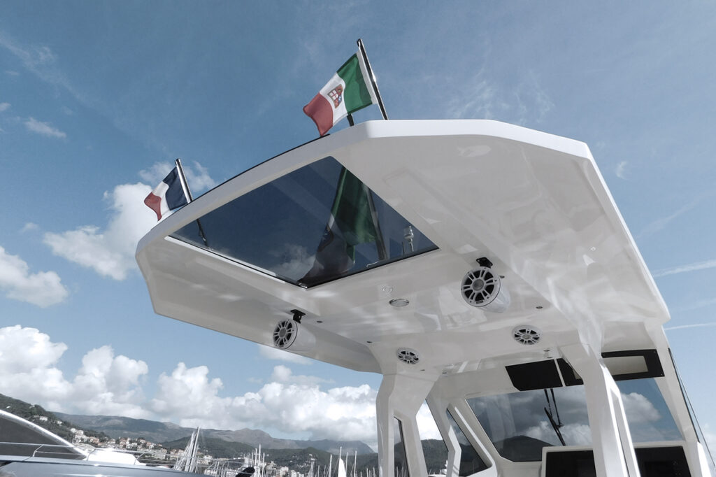 roof of a boat with double flag, italian and french